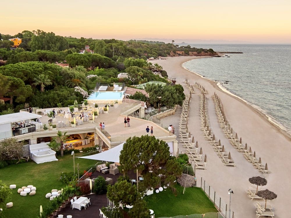 Forte Village Resort beach and gardens at sunset