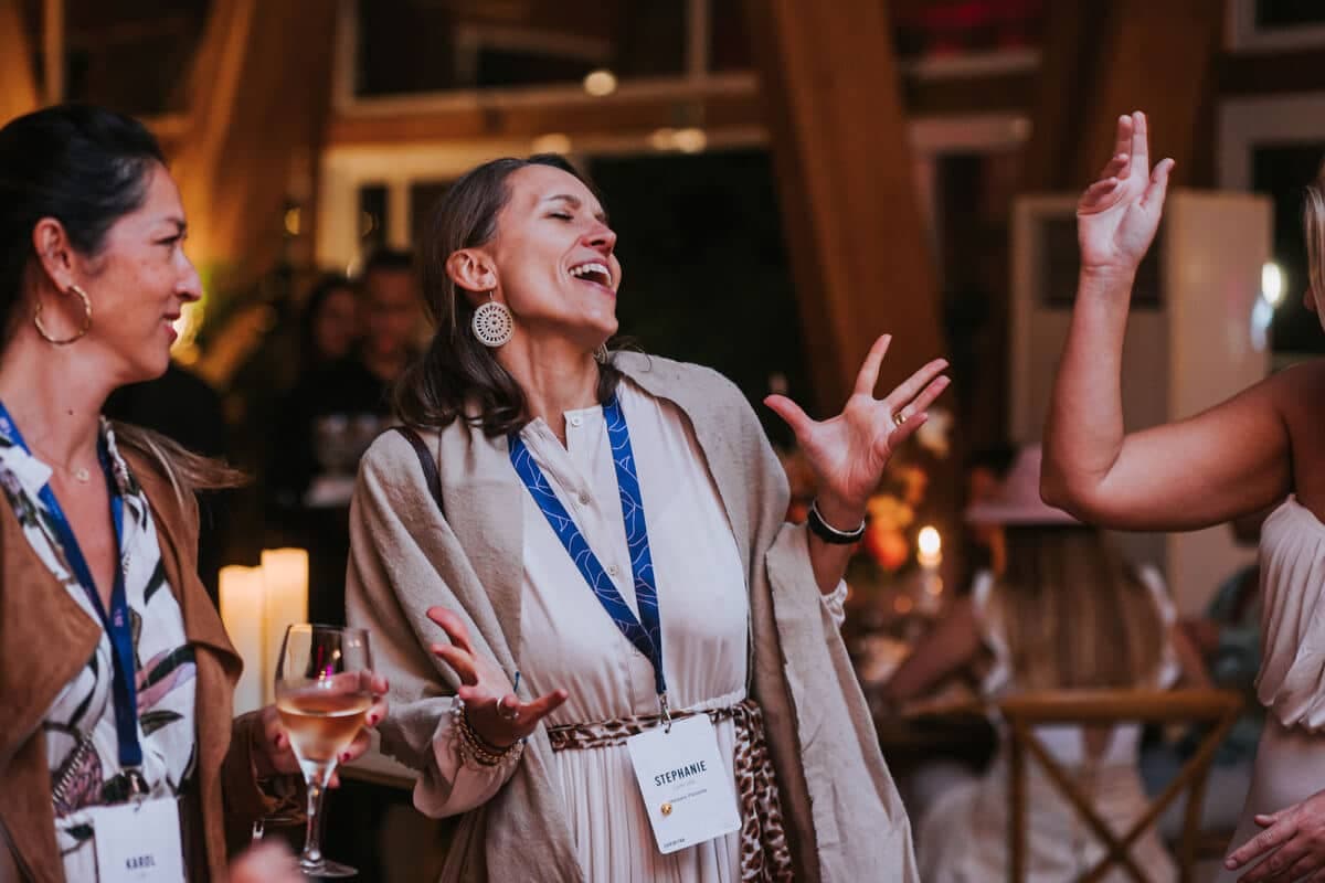 Delegates laughing at an evening reception