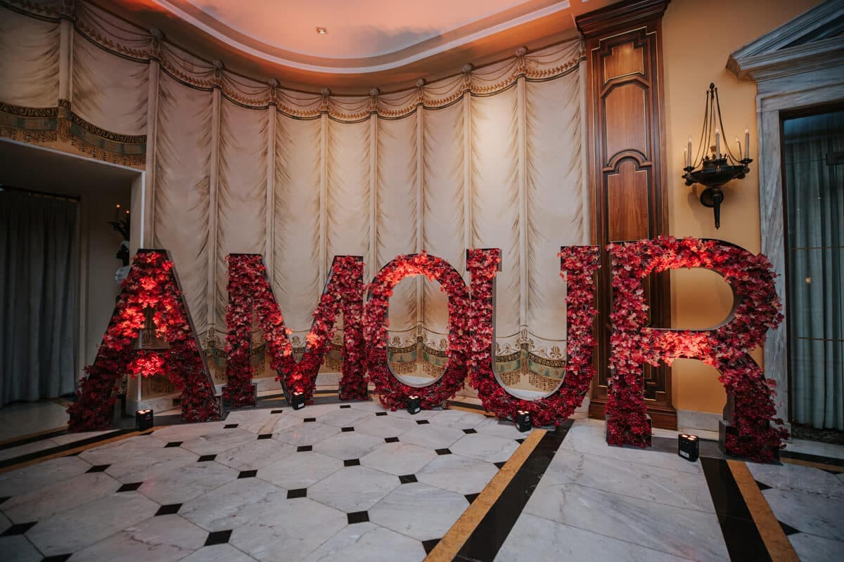 Giant red floral AMOUR letters in a hotel salon