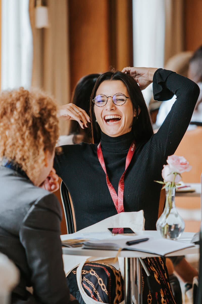 Delegate laughing during a meeting