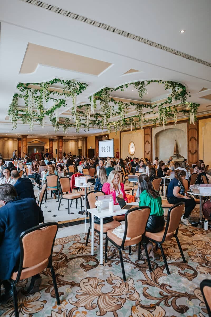 Amour meetings room full of delegates at tables