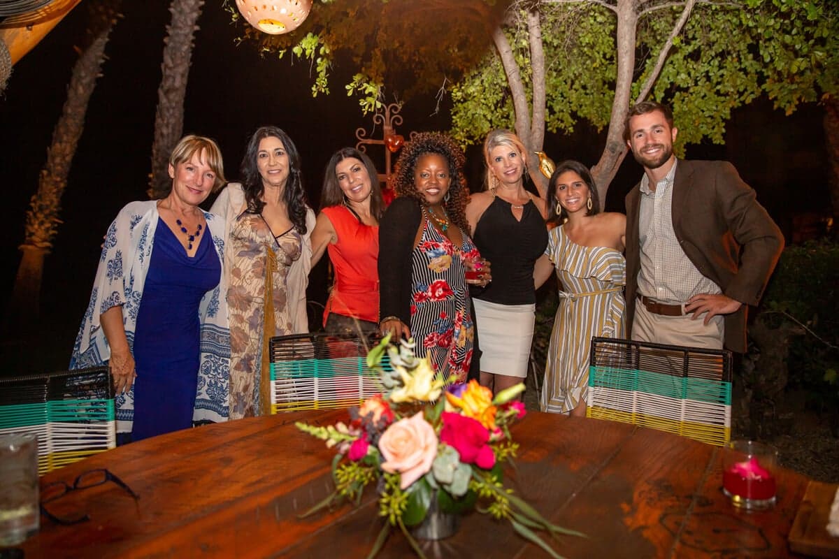 Delegates at a candlelit garden dinner