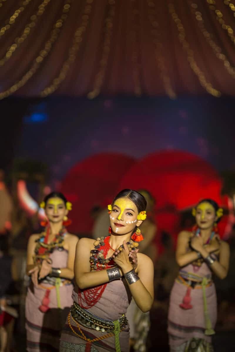 Traditional dancers performing at an evening event