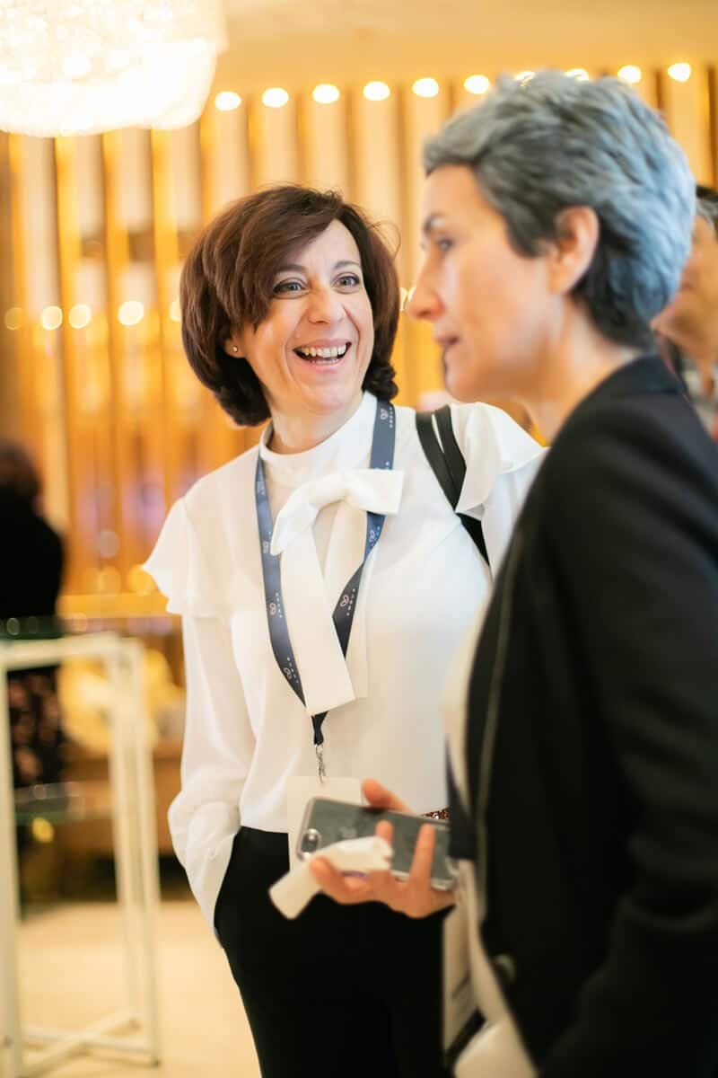 Two delegates chatting at a networking break