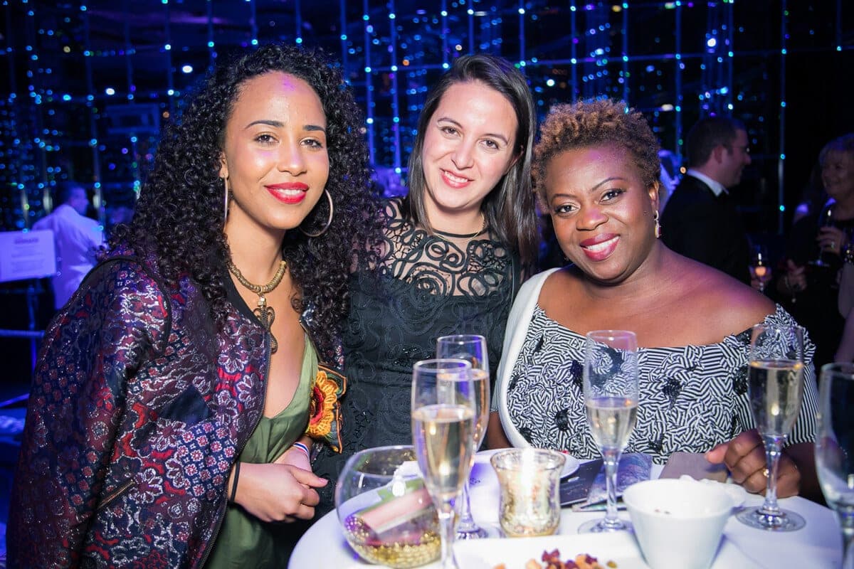 Three guests at a gala dinner table