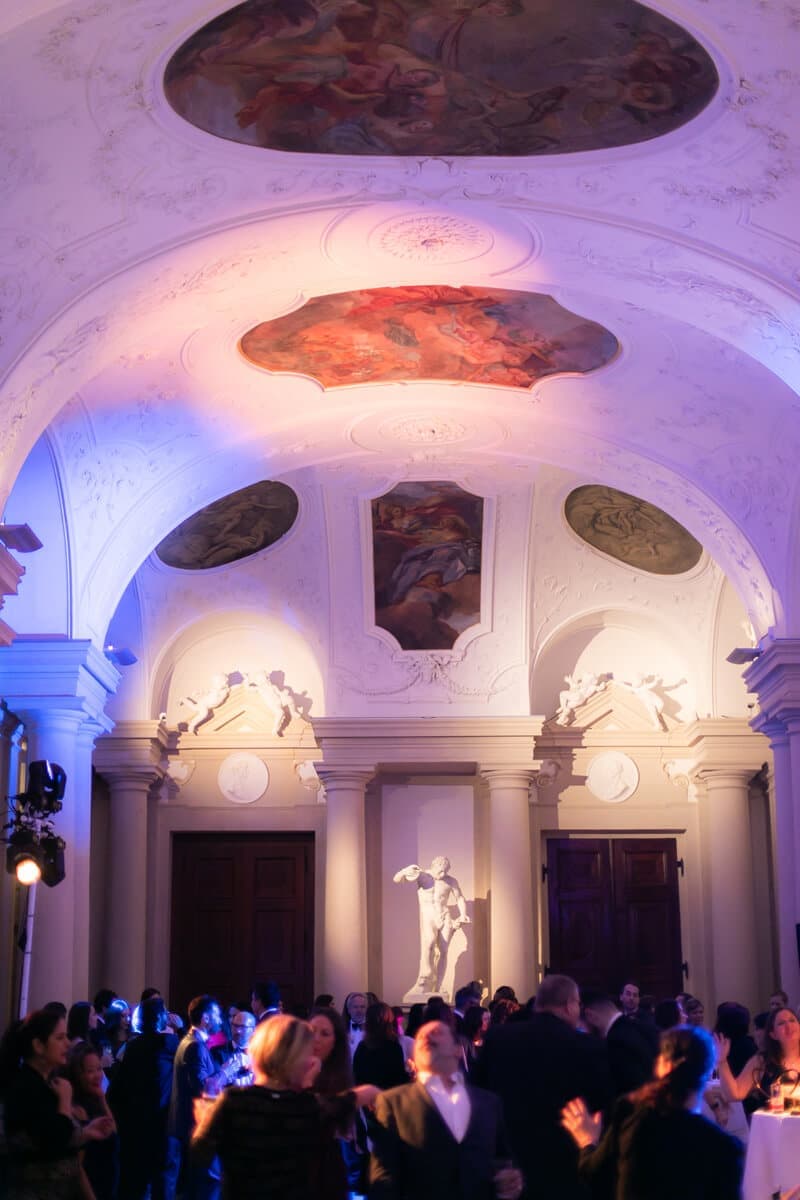 Evening reception in a frescoed hall