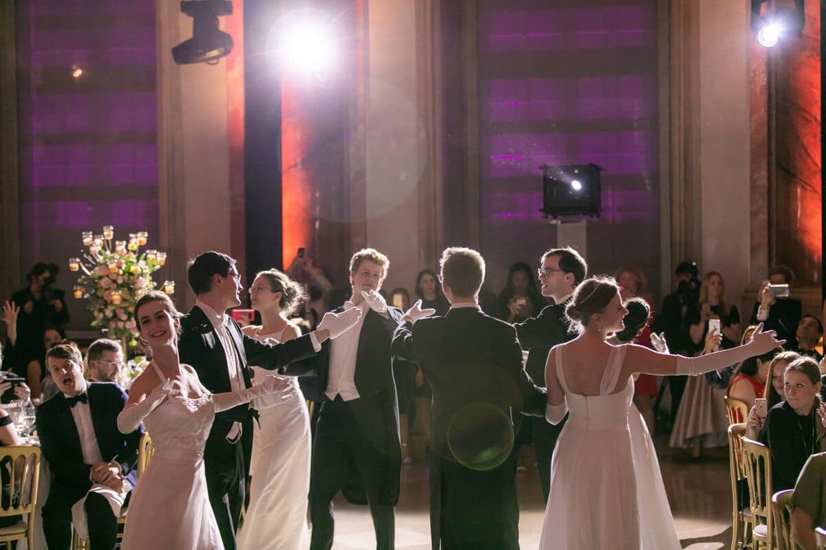Couples waltzing at a ball