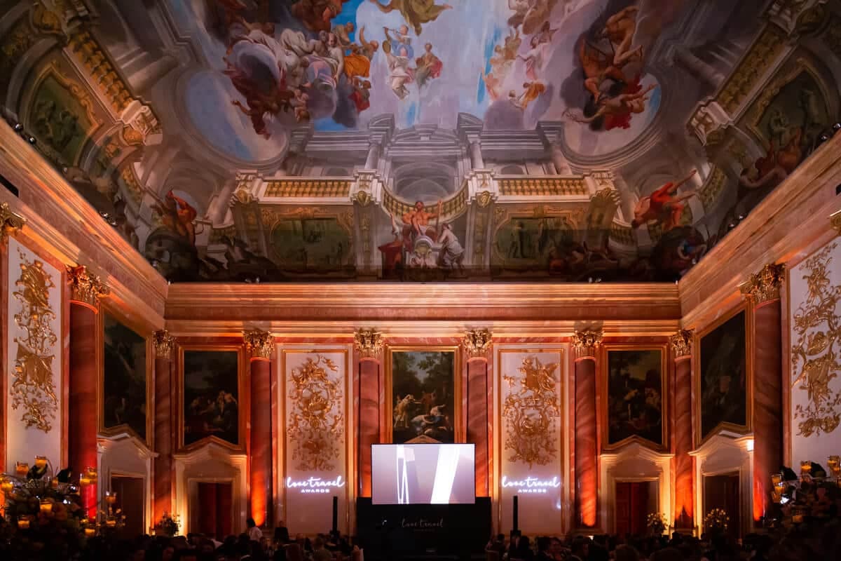 Evening event in a baroque hall with a painted ceiling
